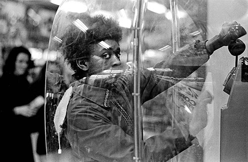 Young woman using a telephone booth Birmingham  (1975)