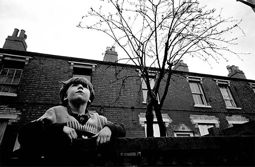 Child dreaming on a fence Birmingham  (1968)