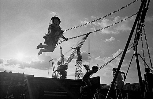 Girl swinging by the Govan shipyards, Glasgow  (1970)