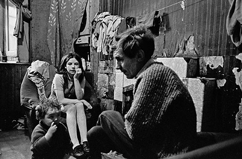 Father and his family living in a Gorbals tenement, Glasgow  (1970)