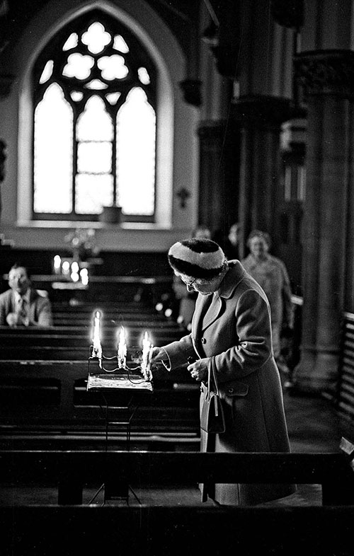 Dedicating a candle Roman Catholic church Wolverhampton  (1976)