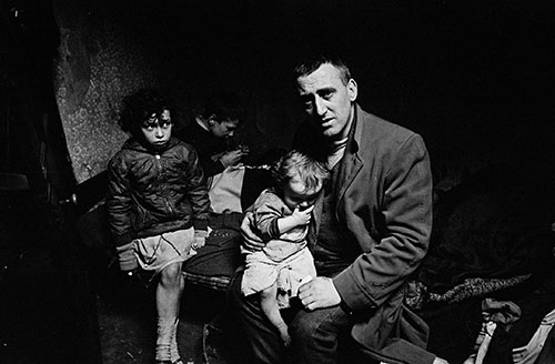 Mr O and his children living in a condemned Liverpool house,  (1969)