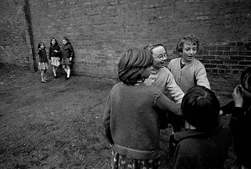children playing in the backyard of their terraced homes, Birmingham 1