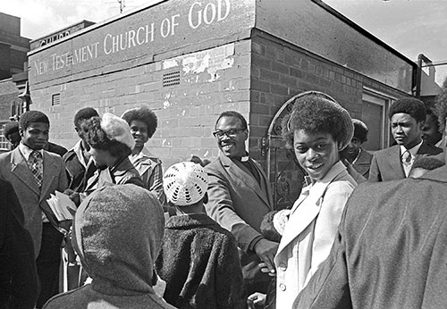Pastor Joseph greets his congregation, New Testament Church of God Wolverhampton  (1976)