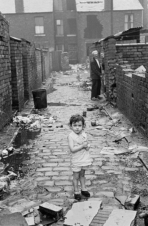 Little toddler wandering alone in Manchester alleyway,  (1972)