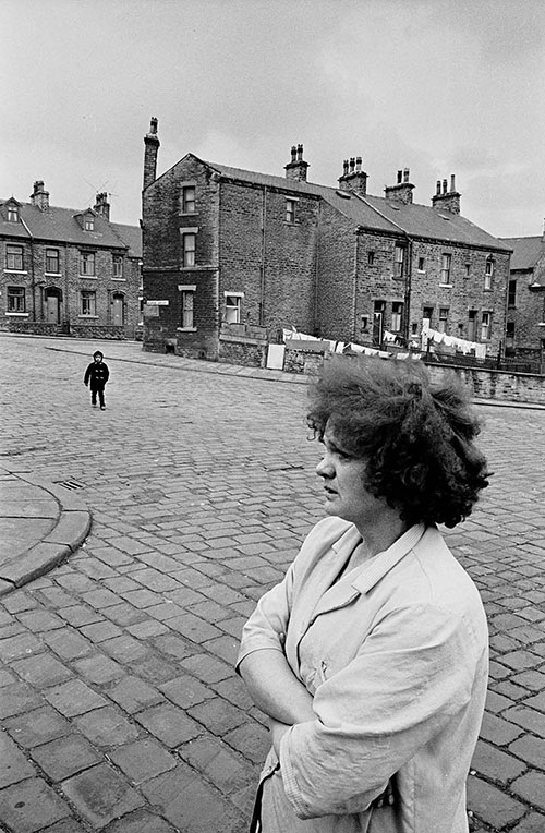 Mother waiting for her child to come home from school, Bradford  (1969)