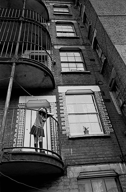 Child dreaming on a Lambeth tenement balcony,  (1969)