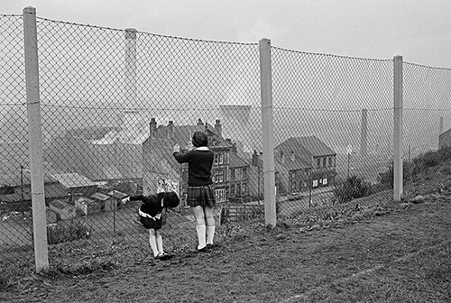 children playing by a fence Bradford  (1969)
