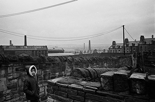 Boy cutting through an alleyway, Bradford  (1969)