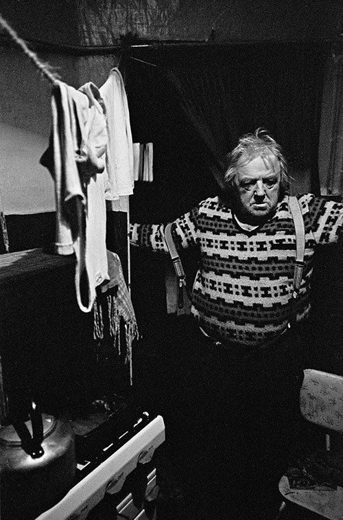 Senior citizen living in a damp basement tenement flat South London  (1971)