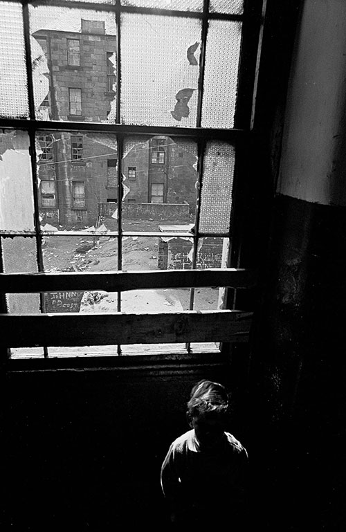 Child on the staircase of his tenement home, Glasgow  (1971)