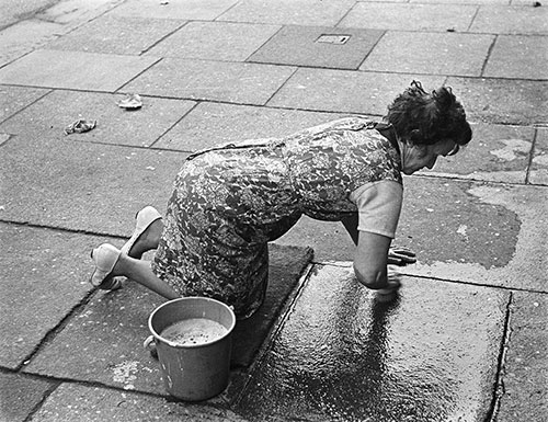 Scrubbing the pavement outside her Liverpool house,  (1969)