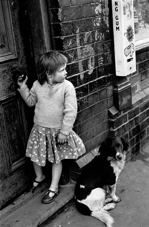 Young girl with her pet dog by her front door, Hockley, Birmingham  (1966)