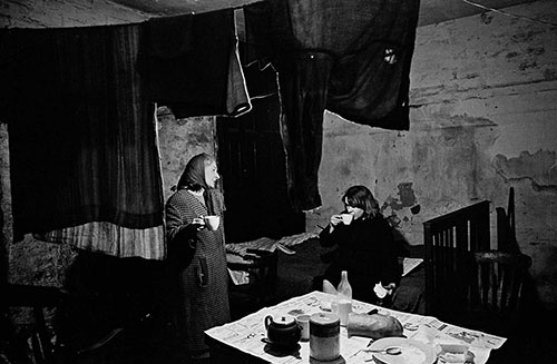 Mrs D and her daughter 2 in their Liverpool cellar flat  (1969)