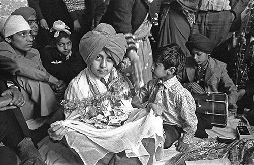 Sikh boy with his gifts, turbanning ceremony Wolverhampton  (1976)