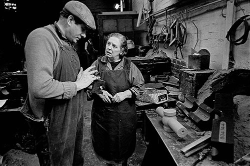 Colleagues discussing moulds, Lee Howl pump factory  (1978)