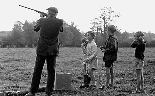 Boys watching clay pigeon shoot  Worcs