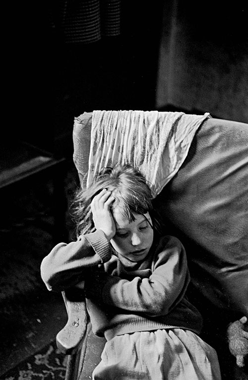 Mrs T daughter asleep in an armchair Sheffield  (1969)