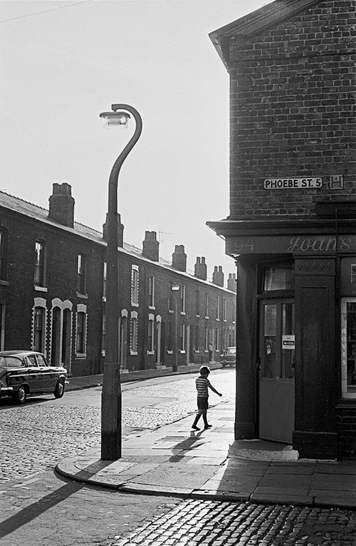 Boy walking down a Manchester street,  (1969)