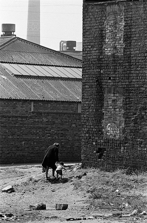 Mother and toddler cross wasteland, Edinburgh  (1972)