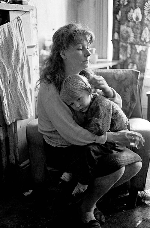 Mother and son living in a slum property in Newcastle's West End  (1971)