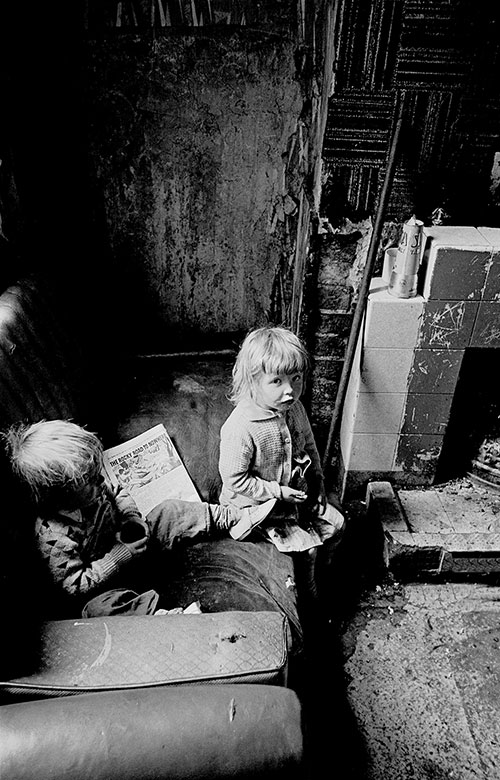 Two children with their comic 'The Rocky Road to Nowhere', Salford (1971)