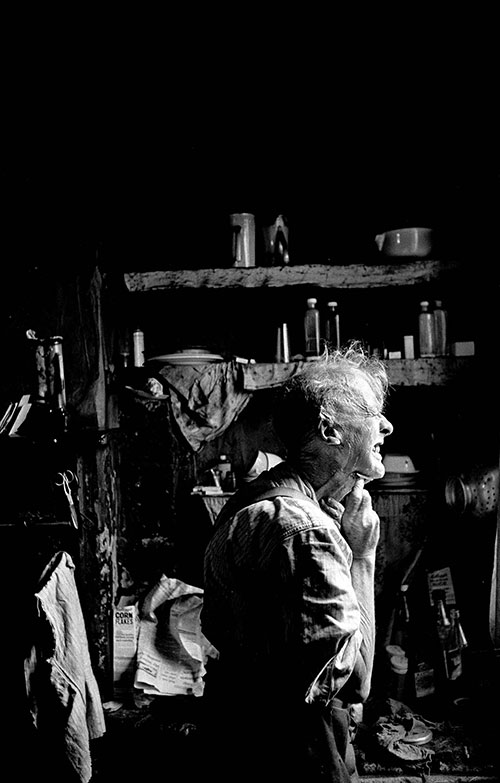 A nearly blind man shaving in his condemned Birmingham terraced house,  (1968)