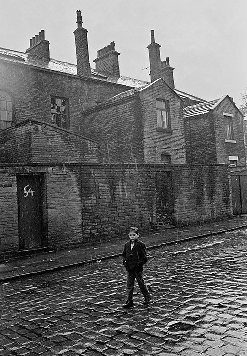 Child walking home through the rain, Bradford  (1969)