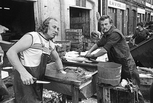 Fish gutter, North Shields quay Tyneside  (1979)