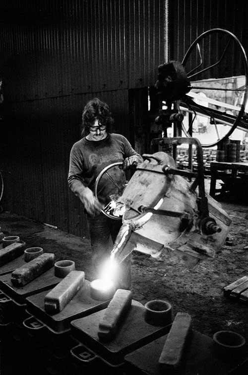 Filling moulds in the foundry at Lee Howl pump factory Tipton  (1978)