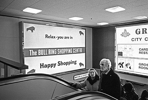 Escalator and advertising Bull Ring shopping centre Birmingham  (1975)