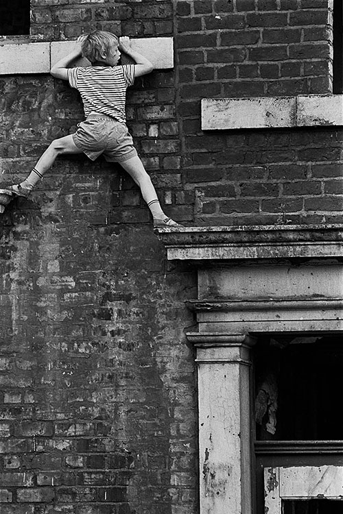 Boy playing on derelict property Newcastle  (1971)