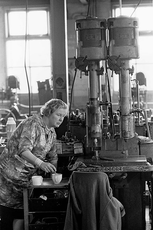 Drill operator stirring her cup of tea, Lee Howl Tipton  (1978)