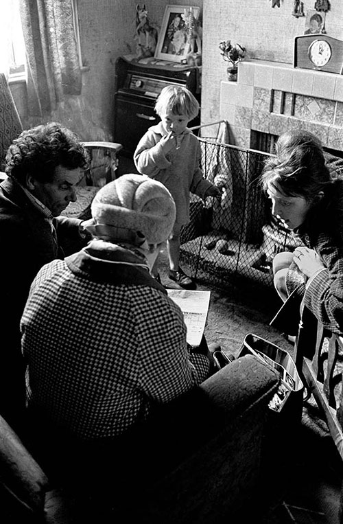 Social worker visits family in slum housing, Birmingham  (1967)