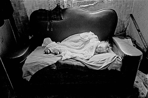 Baby asleep on sofa, Birmingham  (1971)